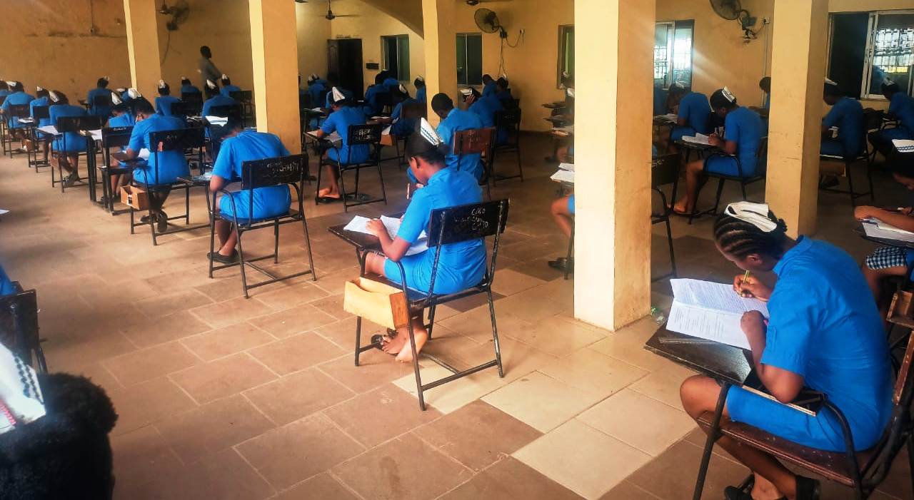 Students of SON Iyienu writing exam